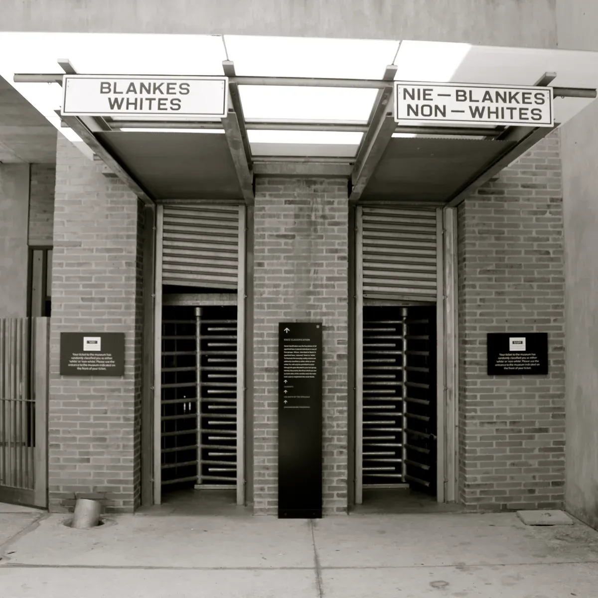 The entrance to the Apartheid Museum in Johannesburg, where the ticket you are handed decides which door you enter — the museum most visitors book first