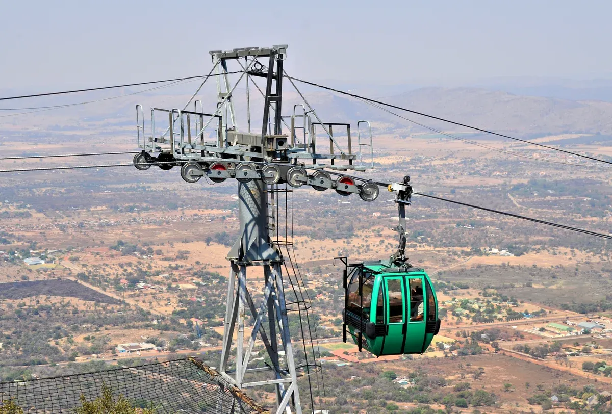 The Harties Aerial Cableway station and cars on the Magaliesberg ridge above Hartbeespoort Dam