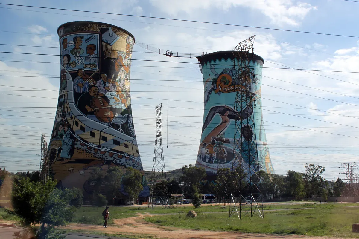 The two painted cooling towers of the Orlando power station in Soweto against a clear sky