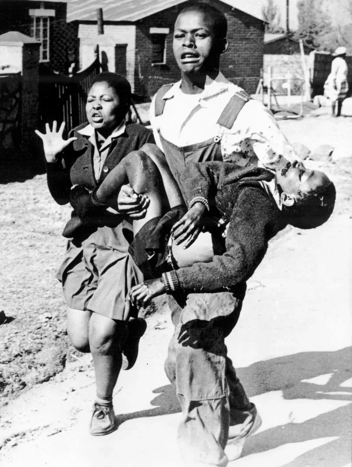 The Sam Nzima photograph: Mbuyisa Makhubo carries the dying Hector Pieterson while his sister Antoinette Sithole runs beside them